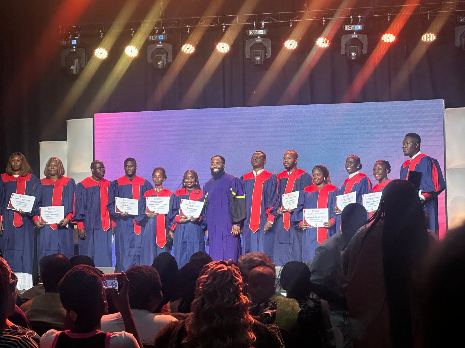 Members of the Arole Ajo Community celebrating a graduation milestone together