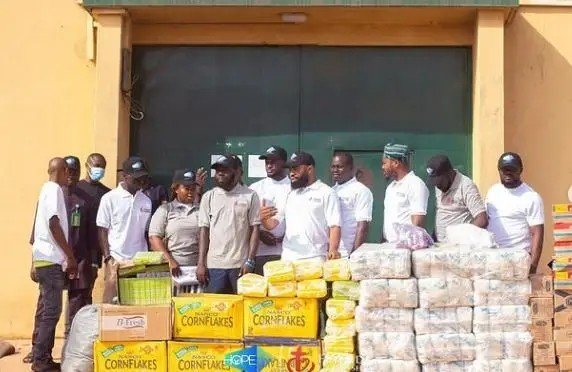 Arole Ajo Community volunteers with donated food and relief supplies for the Prisoners' Legal Aid & Bail Initiative
